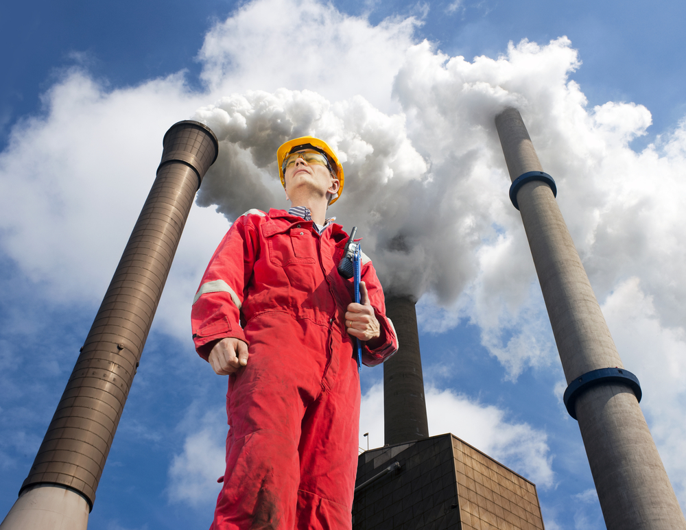 Coming emissions standards for existing power plants must include energy efficiency as a key reduction strategy, say leading efficiency groups. Engineer outside looking up at emissions from power plant.